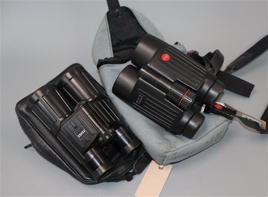 A pair of Leica 8 x 42 BA Trinovid binoculars, number 1016941 and a pair of Zeiss 10 x 40 B T*P* binoculars, cased